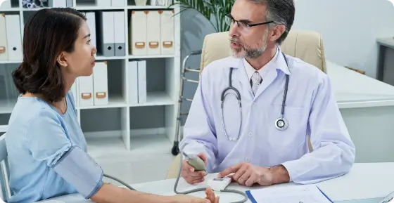 dr checking patient's Blood pressure